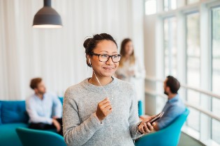 woman in office setting leading a meeting