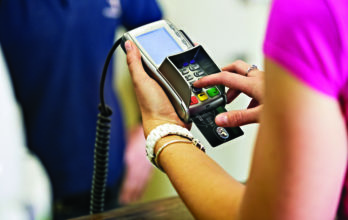 picture of a POS point of sale system with a black credit card
