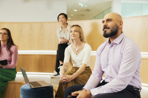 Diverse colleagues sitting in a lecture theatre