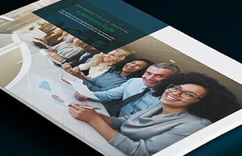 Customers for life brochure cover pic of smiling employees at a long desk