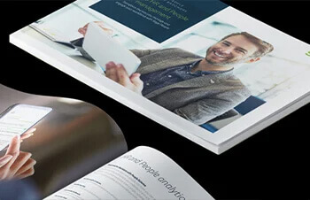 Sage People product brochure cover photo of man working on tablet