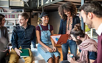 The total economic impact of Sage People - a Forrester Study cover photo of 6 smiling employees in loft office