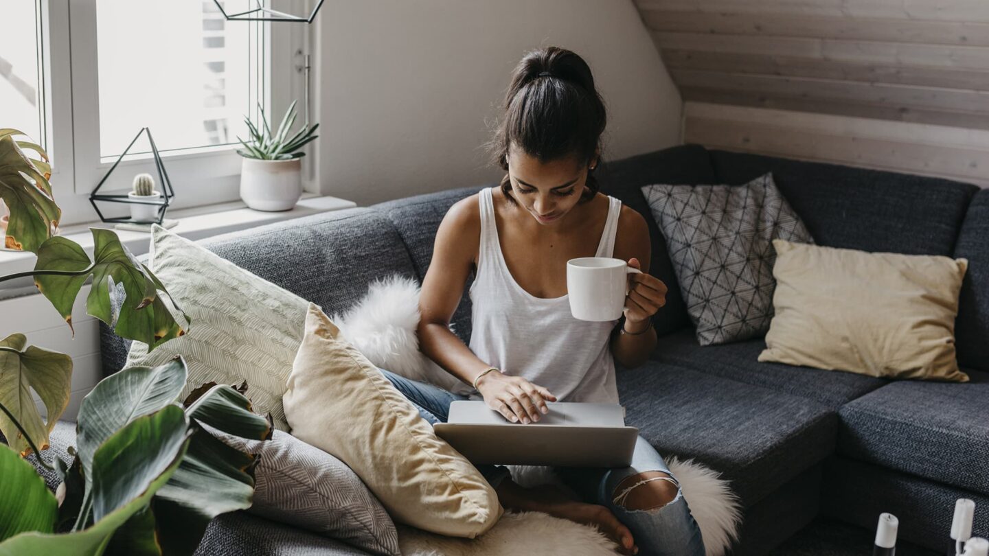 Working from home with tea in hand