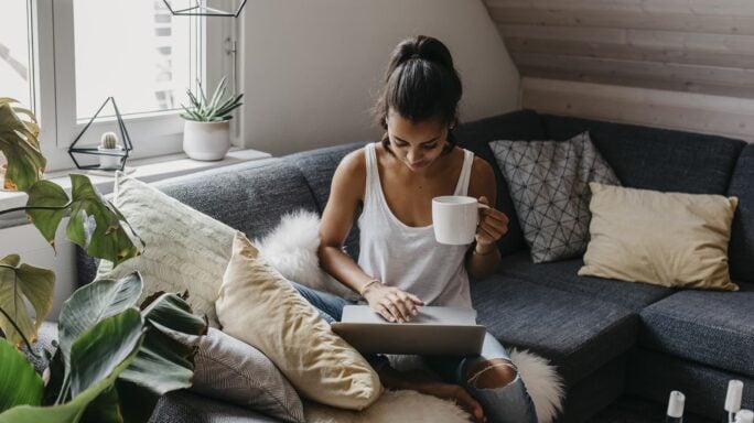 Working from home with tea in hand