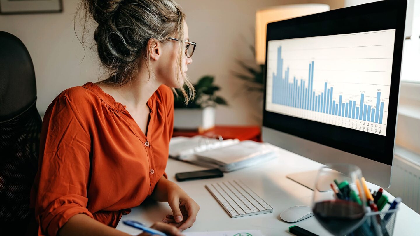 A woman in front of a computer