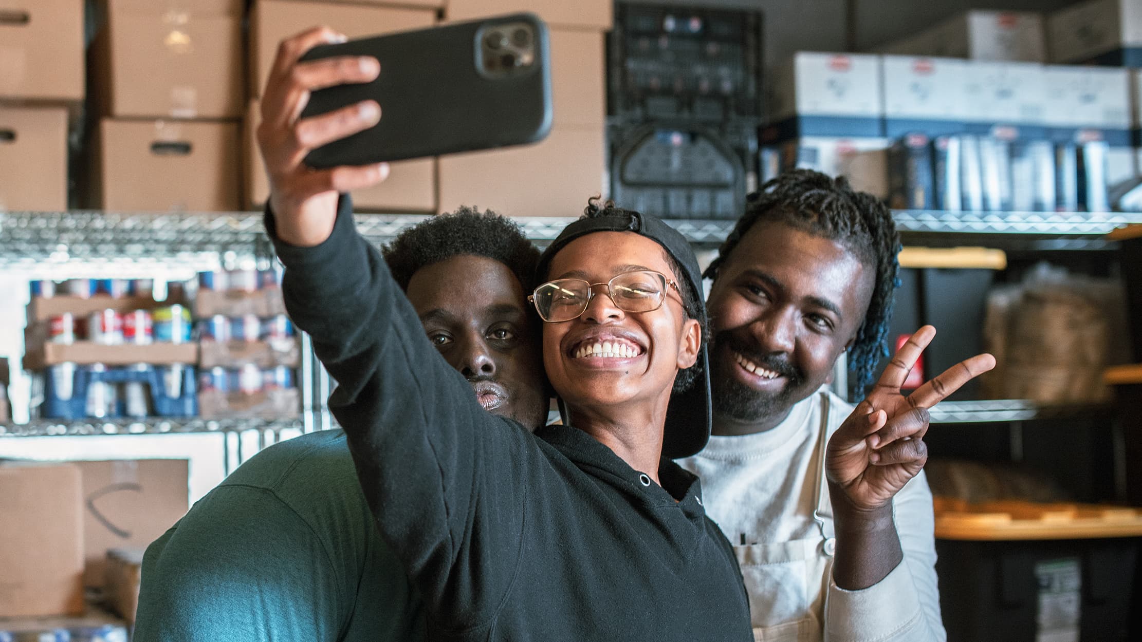 Boy talking a selfie with Black family
