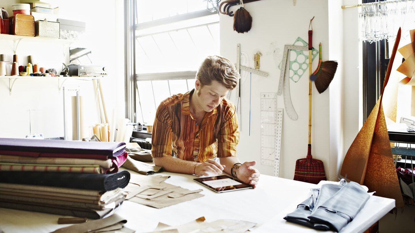 Man working on computer tablet