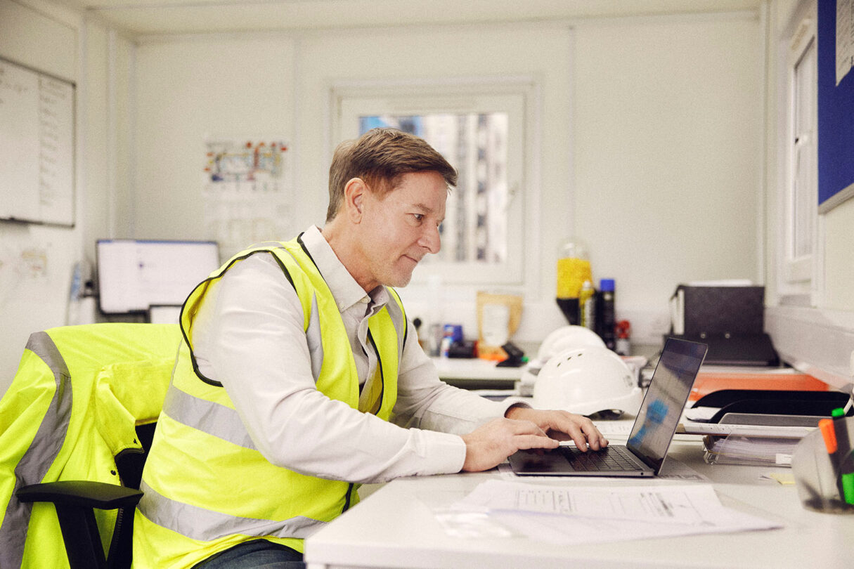 Construction professional at desk