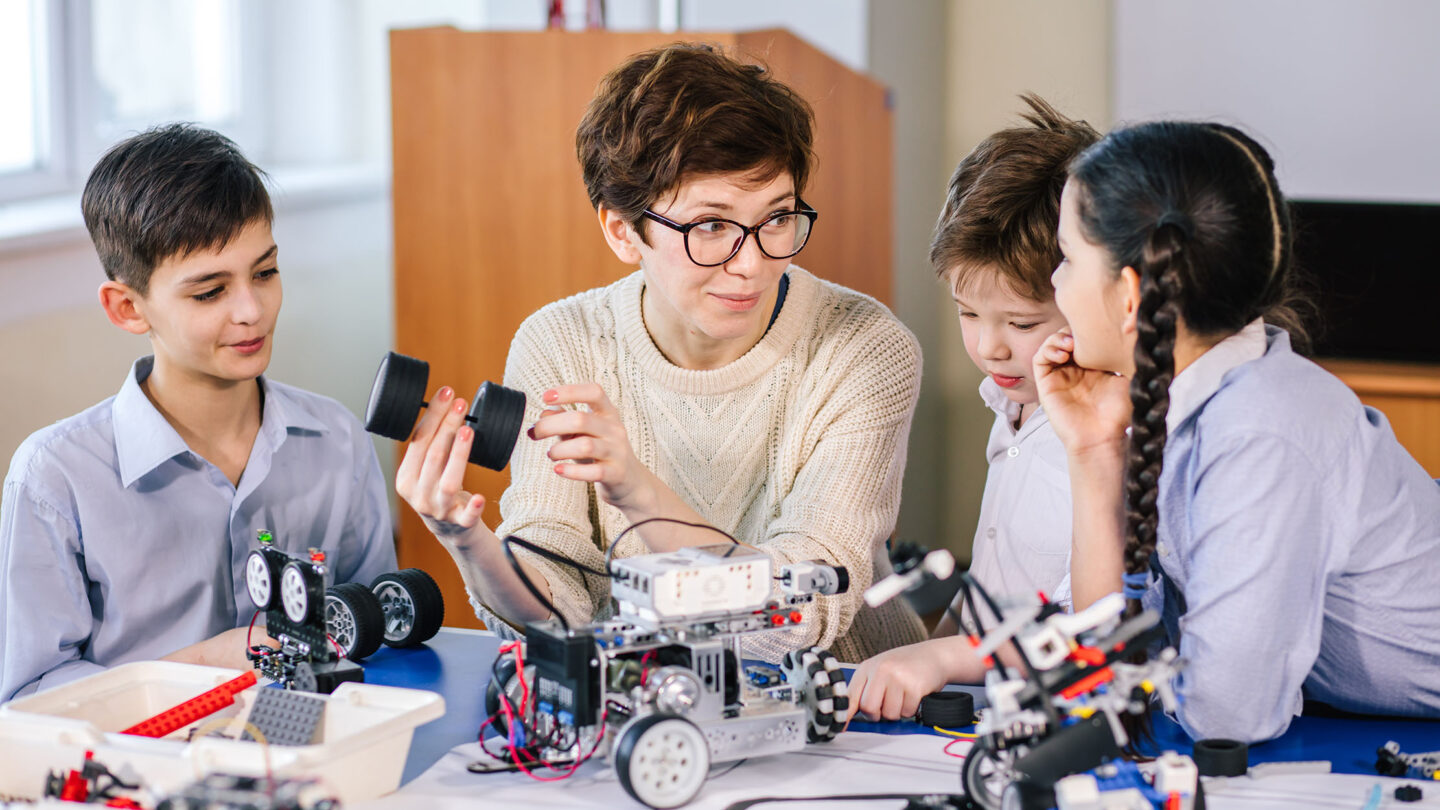Teacher building robots with students
