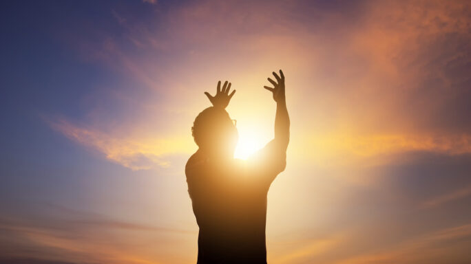 Man of faith raising hands