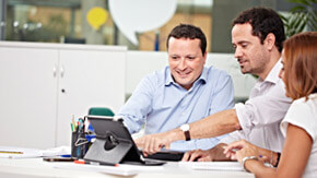 colleagues looking at tablet