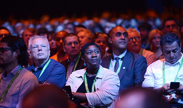 An audience of business leaders at a live event